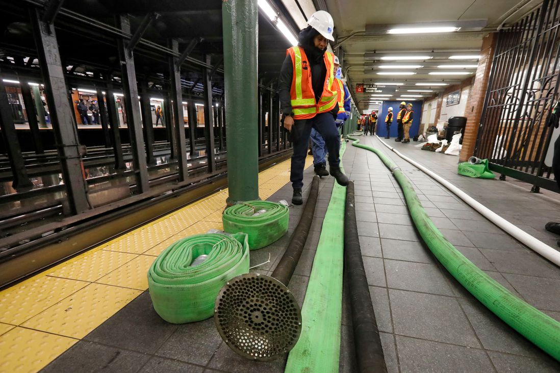 Subway worker prepare to pump water from the Lincoln Center subway station, in New York, . A water main break flooded streets on Manhattan's Upper West Side near Lincoln Center and hampered subway service during the Monday morning rush hour